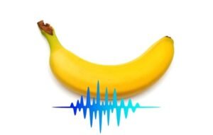 Şok dalga tedavisini temsil eden ses dalgası grafiğiyle birlikte bir muz görseli.